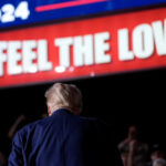 Donald-Trump-back-Feel-the-Love-sign-ap-640x480